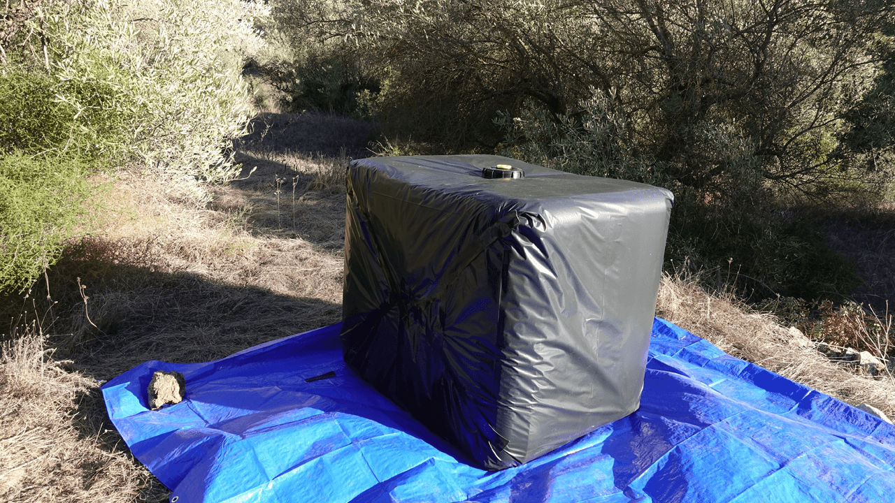 Protecting IBC Totes with Black Tarp