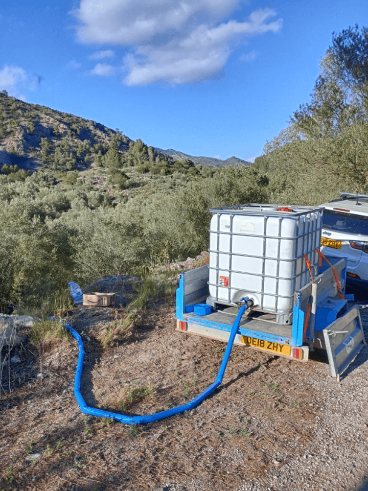 Delivering Water by Car and Trailer